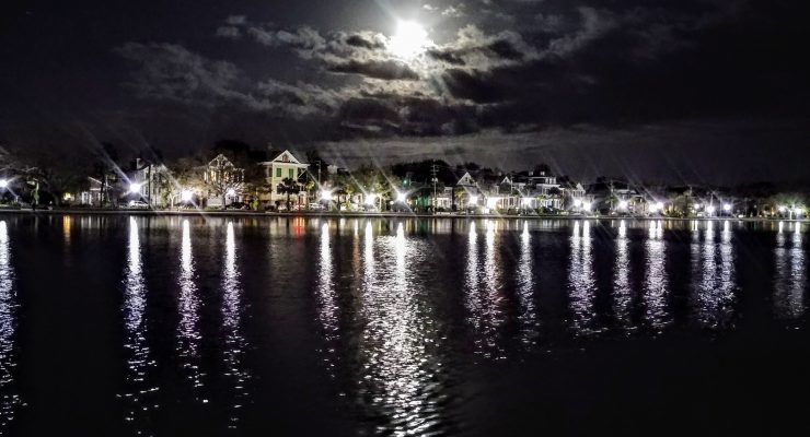 The Supermoon rising over Charleston, captured in the waters of Colonial Lake.