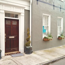 A beautiful door and flower boxes create a classic Charleston , SC scene