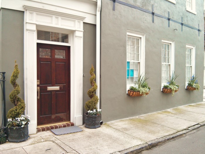 A beautiful door and flower boxes create a classic Charleston , SC scene