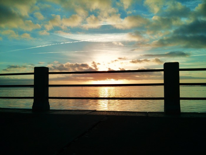 The sun rising over Charleston Harbor, as seen from the High Battery.