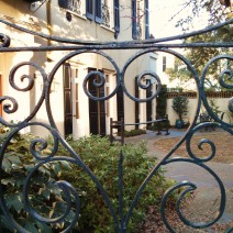 So much of what screams Charleston is here -- beautiful house and garden, joggling board and a beautiful iron gate.