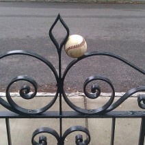 A Charleston celebration of baseball... a Philip Simmons gate catching a ball!