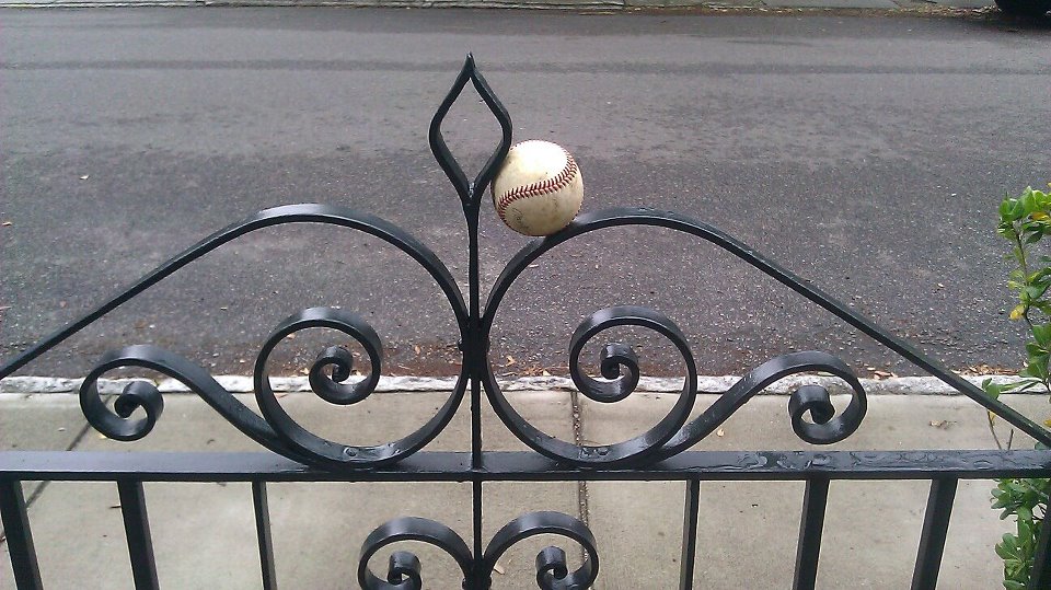 A Charleston celebration of baseball... a Philip Simmons gate catching a ball!
