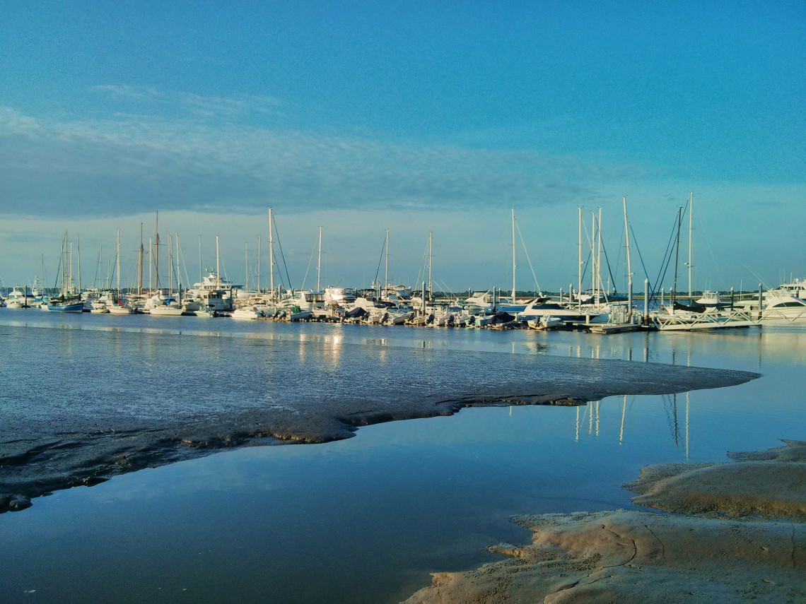 Low tide and boats at rest in the early morning Charleston light.
