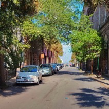 A view down Queen Street to the flags of Waterfront Park in Charleston, SC.