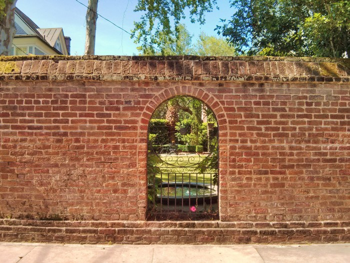 A hole in the wall in Charleston, SC more often than not reveals a beautiful garden.