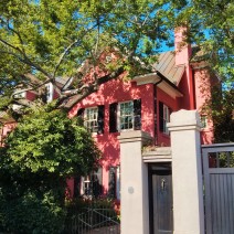 Nestled in some beautiful trees, this pink house in Charleston, SC has a fairytale quality to it.
