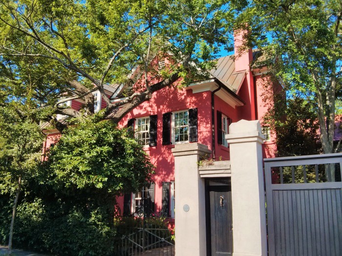 Nestled in some beautiful trees, this pink house in Charleston, SC has a fairytale quality to it.
