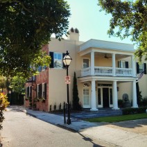 The beauty of Charleston, SC architecture takes many forms. Here there is an unusual combination of brick, stucco and a side portico.
