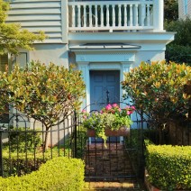 Tucked under the piazza, this cute little door leads into a beautiful Charleston, SC house.