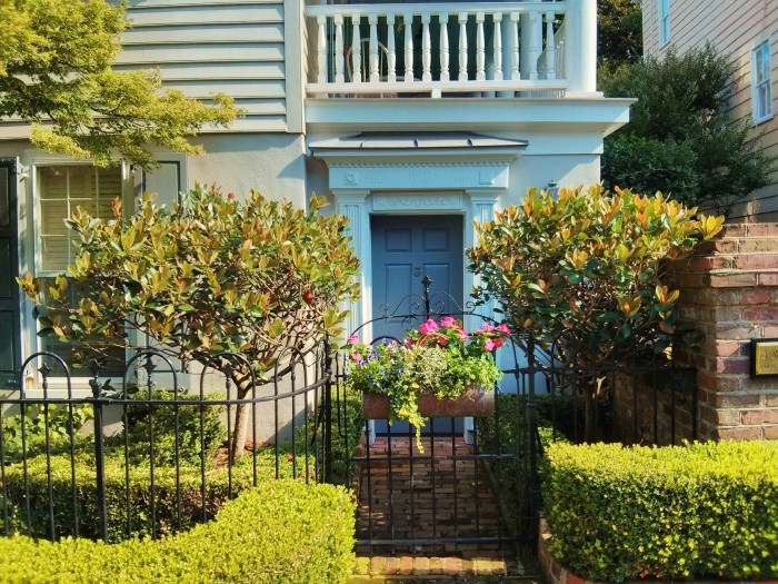 Tucked under the piazza, this cute little door leads into a beautiful Charleston, SC house.