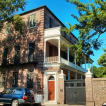 The shutters on this large Charleston, SC house are closed to help keep the sun out and the house cool on hot summer days.