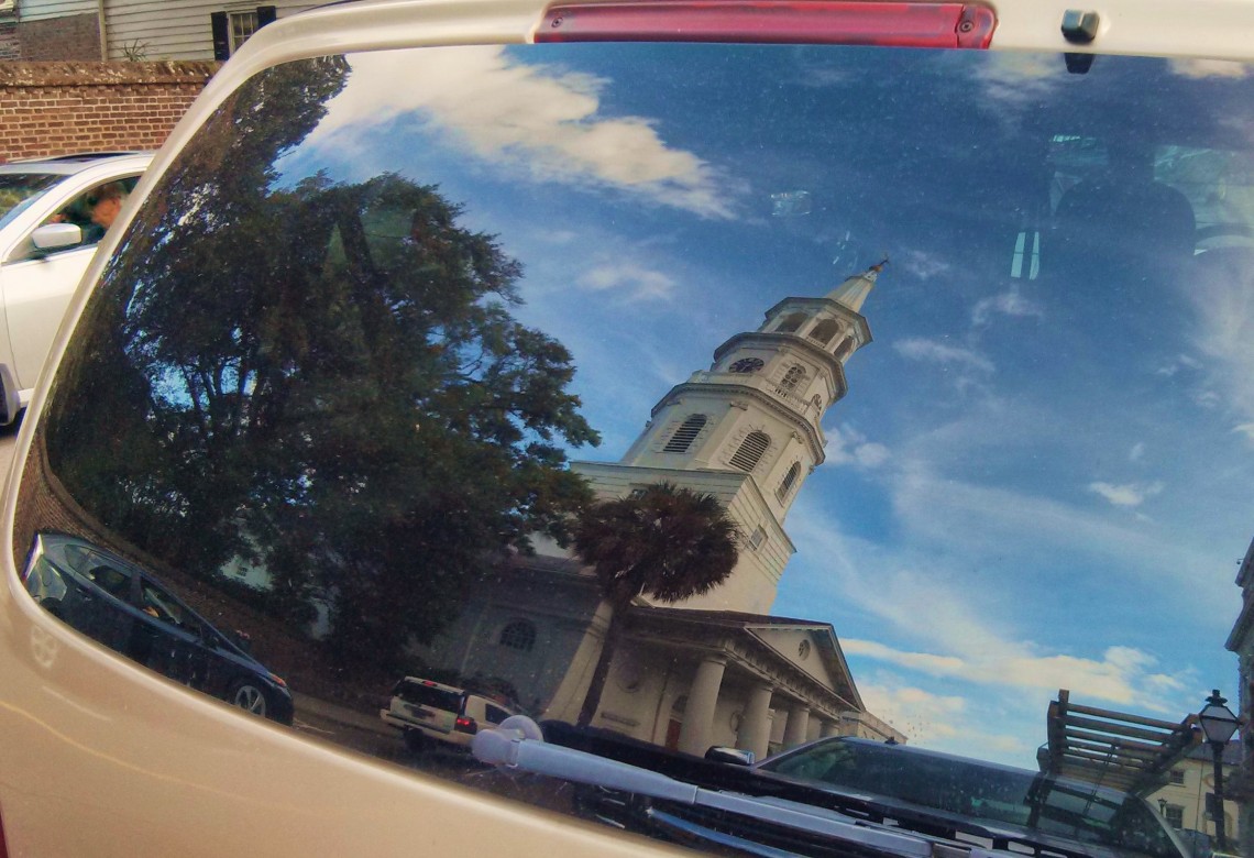 Th reflection of St. Michael's Church in Charleston, SC, caught in the rear window of a van on Meeting Street.