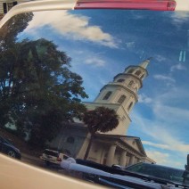 Th reflection of St. Michael's Church in Charleston, SC, caught in the rear window of a van on Meeting Street.