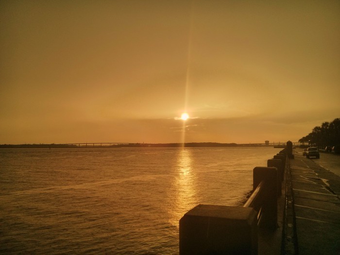 This is not a black and white photo. It is the sun setting over the Ashley River in Charleston, SC during a break in a rainstorm.