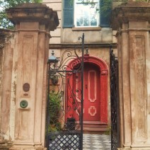 A beautiful Charleston, SC entryway... complete with magnificent walls and gates and a bust over the doorway.