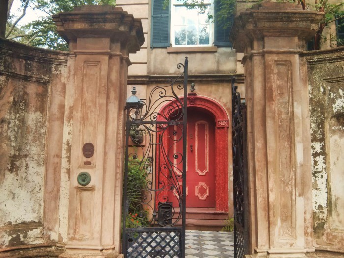 A beautiful Charleston, SC entryway... complete with magnificent walls and gates and a bust over the doorway.
