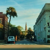 The early morning sun lights up the steeple of St. Philip's Church, as seen from the corner of Church and Broad Streets in Charleston, SC.