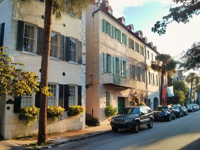 The early morning sun filters on to Queen Street in Charleston, SC, lighting up its beautiful antebellum row houses.