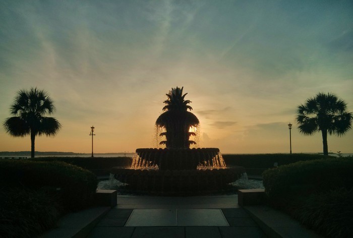 The sun rising behind the beautiful Pineapple Fountain in Charleston, SC's wonderful Waterfront Park.