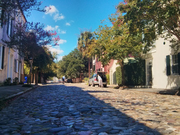 Charleston, SC, despite the wonderful colonial feel, is a living city. Here the mailman and a resident do their thing on this cobblestone street.