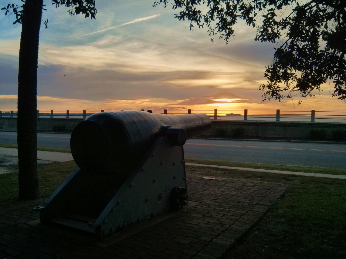 This Civil War era cannon (from the USS Keokuk) once fired shells at Fort Sumter. Now, from its home in White Point Garden in Charleston, SC., it looks like it is training its sights on a passing cargo ship or the rising sun.