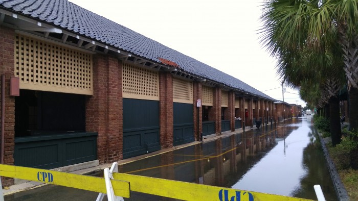 After days of super high tides and torrential rains, despite pockets of standing water in places, Charleston is drying out. Here the City Market still has to deal with some flooding.