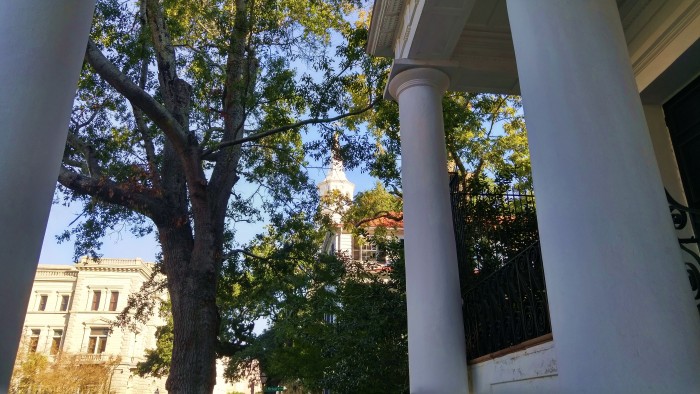 A peek of the steeple of St. Micheal's Church in Charleston, SC through the columns of Society Hall.