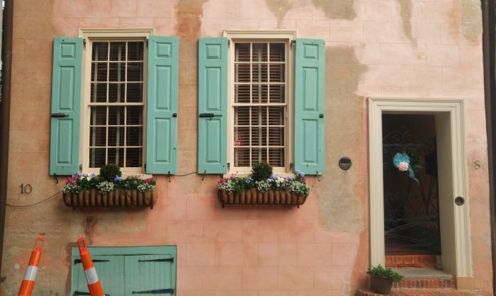 A classic Charleston scene... a beautiful old home with wonderful window boxes, ironwork, shutters and stucco.