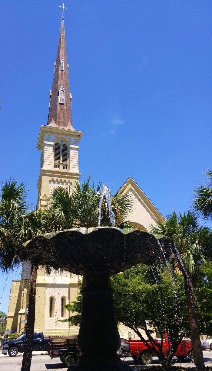 A beautiful view of the striking steeple of Citadel Square Baptist Church on Meeting Street, as seen from behind the lovely fountain in Marion Square.