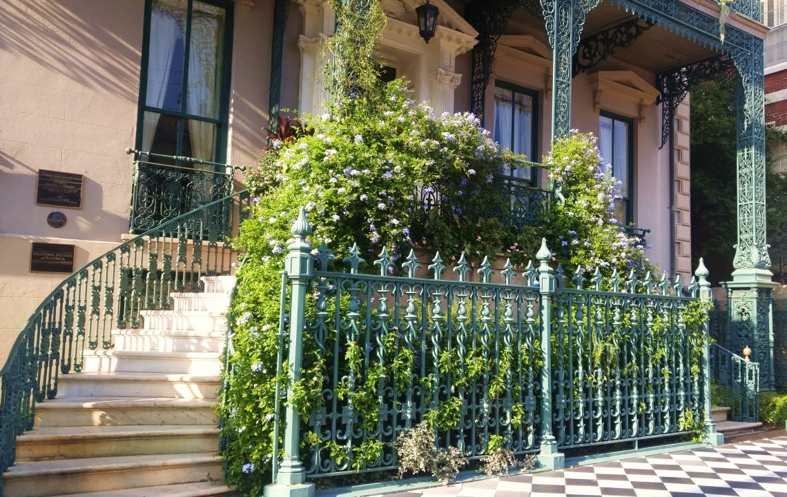 The sidewalk, ironwork and entryway of the John Rutledge House on Broad Street are iconic Charleston symbols.