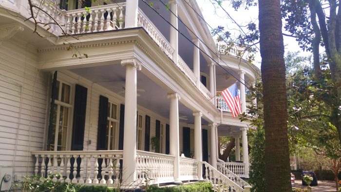 The color of the ceiling of these Charleston porches is called "Haint Blue." It is believed that it will keep the "haints" (spirits of the dead) from hanging out in that house.