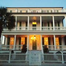 A beautiful antebellum (built in 1835) house on South Battery lighting up as the sun starts to go down in Charleston. 
