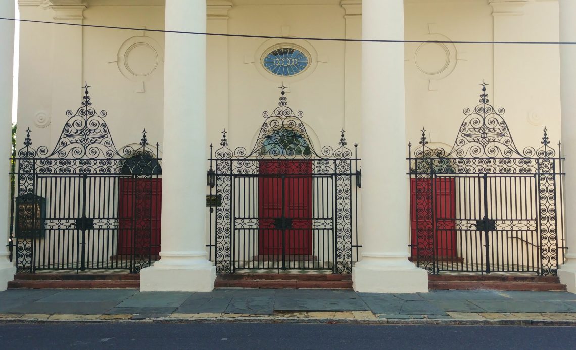 These beautiful red doors, protected by the wonderful iron fence and gates, are found at St. John's Lutheran Church on Archdale Street. Built  in 1816-18, to replace a wooden structure, it is believed to have been designed by Frederick Wesner -- who also designed the Old Citadel building, as well as the portico of the South Carolina Society Hall. Interestingly, the ironwork was designed by Wesner's brother-in-law, Abraham P. Reeves. 