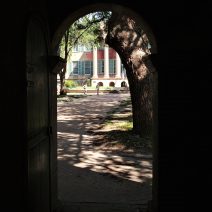 The  Porters Lodge at the College of Charleston has three passages from George Street into the Cistern Yard. Two are pedestrian-sized, as seen in this photo, one can accommodate much larger vehicles as seen here. They are all gateways on to some incredible historic beauty.