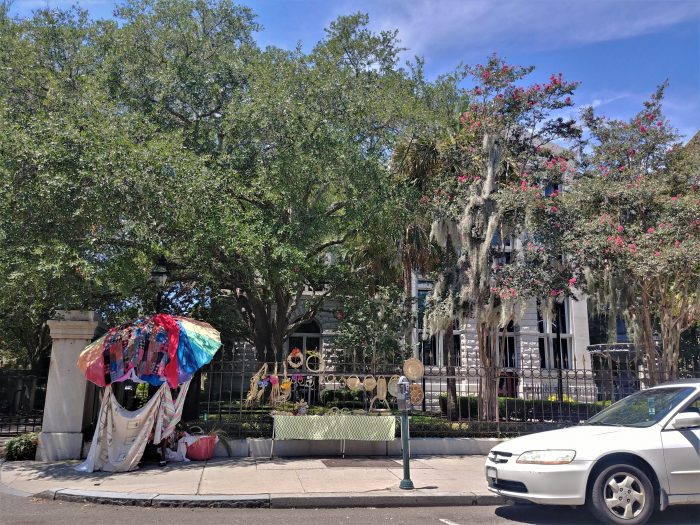 This wonder combination of Flower Lady baskets, a blooming crepe myrtle, Spanish moss, a magnificent live oak tree and a beautiful fountain is along the elegant iron fence in front of the Federal Courthouse at the Four Corners of Law. Classic Charleston.