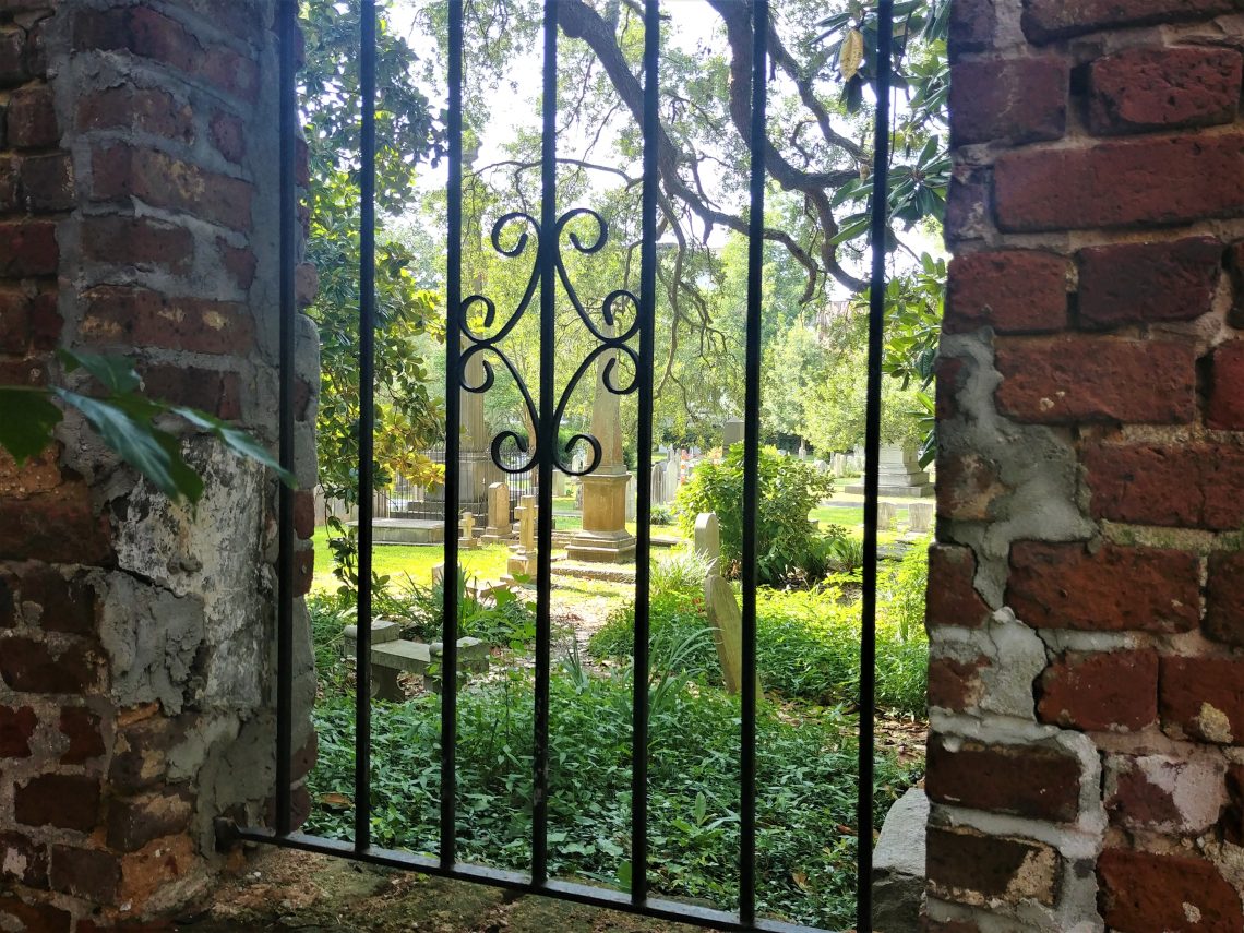 This barred view into the Circular Church's graveyard is through an old wall behind some private property on Queen Street. The graveyard is thought to be the oldest English burial ground in Charleston, with its oldest grave dating back to 1695.