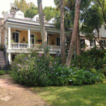 While this beautiful Charleston house may look like a country cottage, it is right in the middle of downtown on Montegu Street.