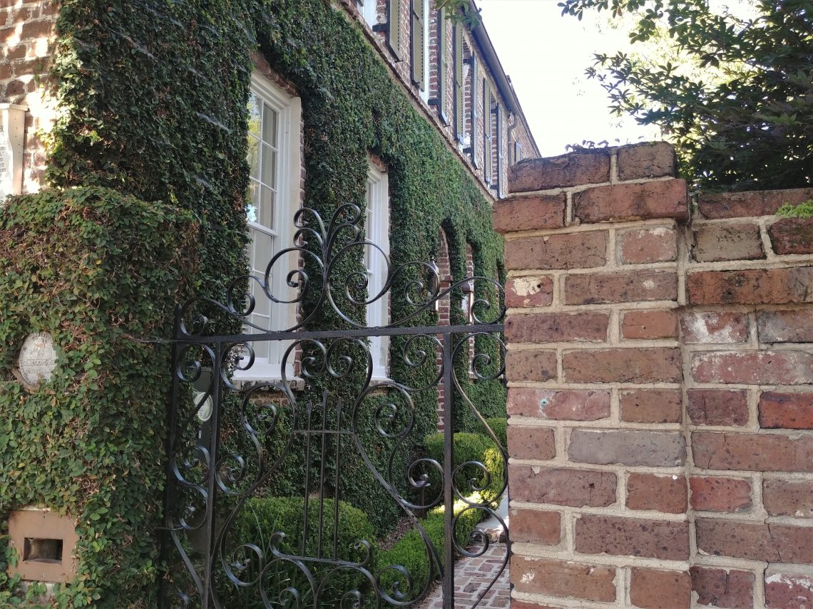 This beautiful Charleston gate on King Street is made from wrought iron -- meaning that each piece was individually heated and then bent by hand (most often hammered over an anvil). Most of the decorative ironwork in Charleston was made this way, as opposed to cast iron where molten metal is poured into a mold, and each piece is identical.