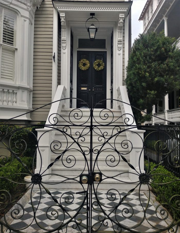 This beautiful gate, walk and doorway can be found on Tradd Street. This house, and two of its neighbors were built in the early 1880's -- each having a distinctive bay window in the front of the house, which is not commonly found in the local houses. 