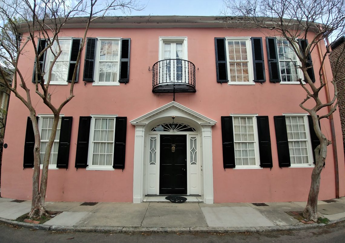 The house on Tradd Street, circa 1740, is guarded by two crepe myrtle trees -- the longest blooming plants in Charleston.