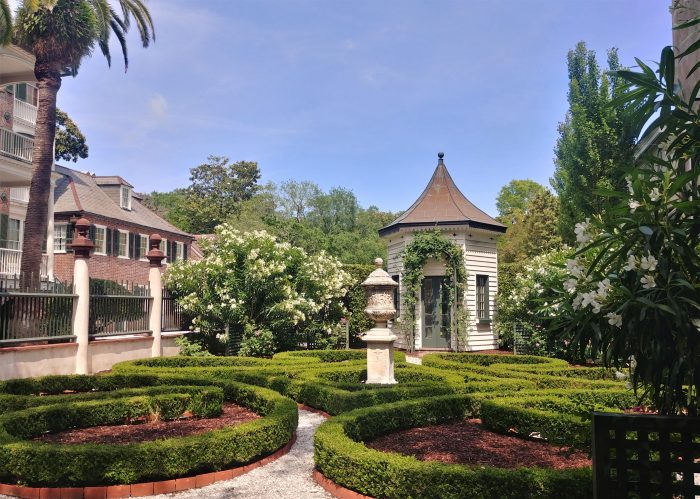 This garden belongs to the Simmons-Edwards House on Legare Street, more commonly referred to as the Pineapple Gates House. The stone pineapples are a symbol for "welcome."