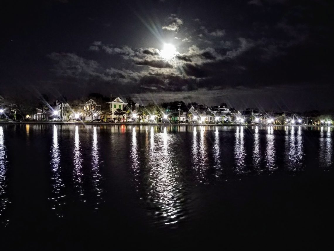 The Supermoon rising over Charleston, captured in the waters of Colonial Lake.