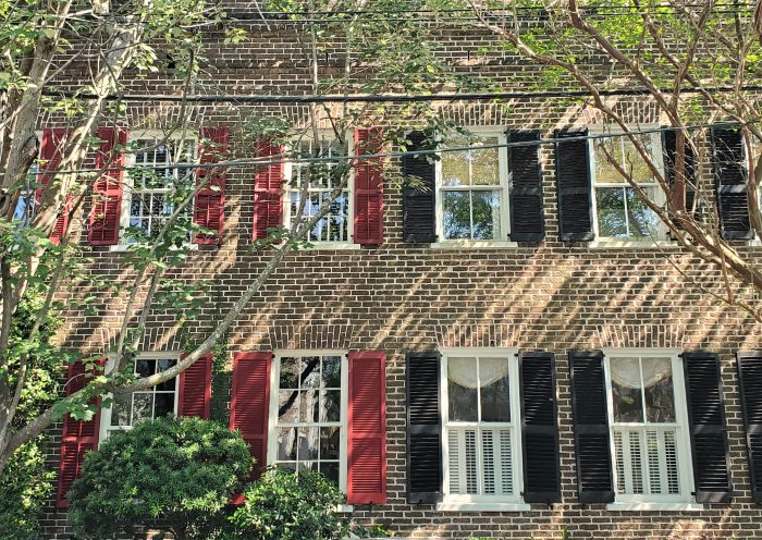 This house is actually not schizophrenic, but connected individually owned row tenements. Built in about 1841 on land that was cleared on Wentworth Street after the great fire of 1838, originally there were seven connected buildings -- now six remain. 