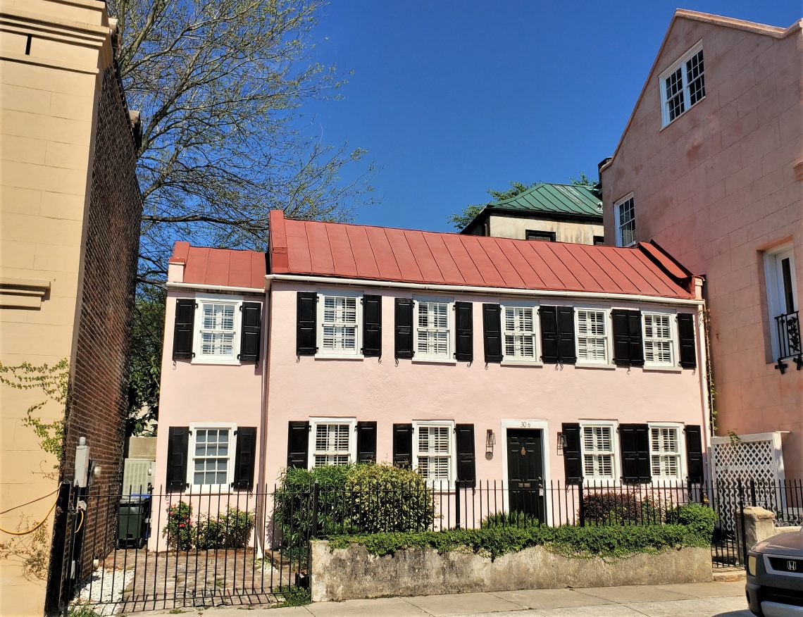 This cute little pink house, built c.1850,  is located at 30 1/2 State Street in the French Quarter of Charleston.