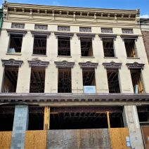 When the 200 year old facade of this building on King Street started bowing out and threatening to fall and crush pedestrians, the Nicks BBQ that had been there for 12 years had to move out. While no one was injured and the building has been stabilized and is being rehabilitated, the cheese biscuits they served have been missed.