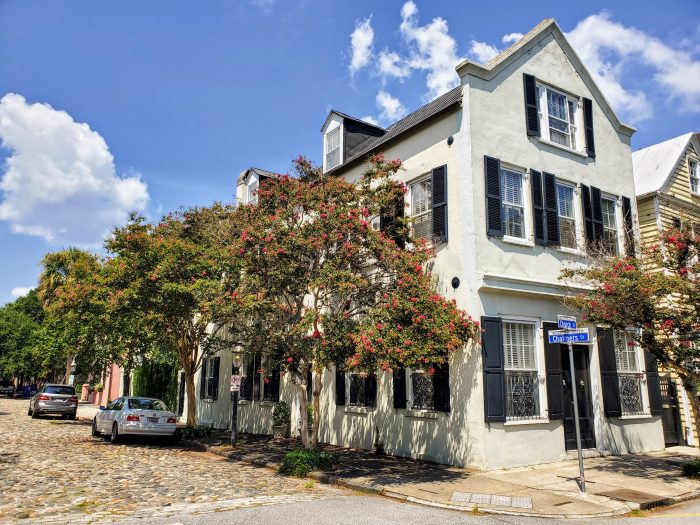 Charleston cobblestones and crepe myrtles at the corner of Chalmers and Church Streets.  If you turned to the right on Church Street, you'd have a great view of St. Philip's steeple as you walked by the French Huguenot Church.