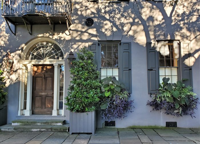 This beautiful house at the corner of Tradd and Meeting Streets, originally completed c. 1772, has been modified a number of times over the years. After the Civil War, it was purchased in 1872 by John Doscher -- who used the whole first floor to create Doscher's Grocery, complete with storefront. While the building was later fully restored to house form, you can still find Doscher's Grocery stores in the Charleston area (although they  seem to originate from a different branch of the family). 