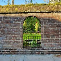 A beautiful wall, that allows a lovely view into the garden, can be found on Lamboll Street.