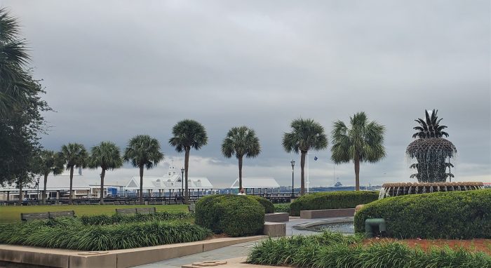 A view across Joe Riley Waterfront Park. In the distance you can see the WWII aircraft carrier the USS Yorktown, a storied fighting ship.